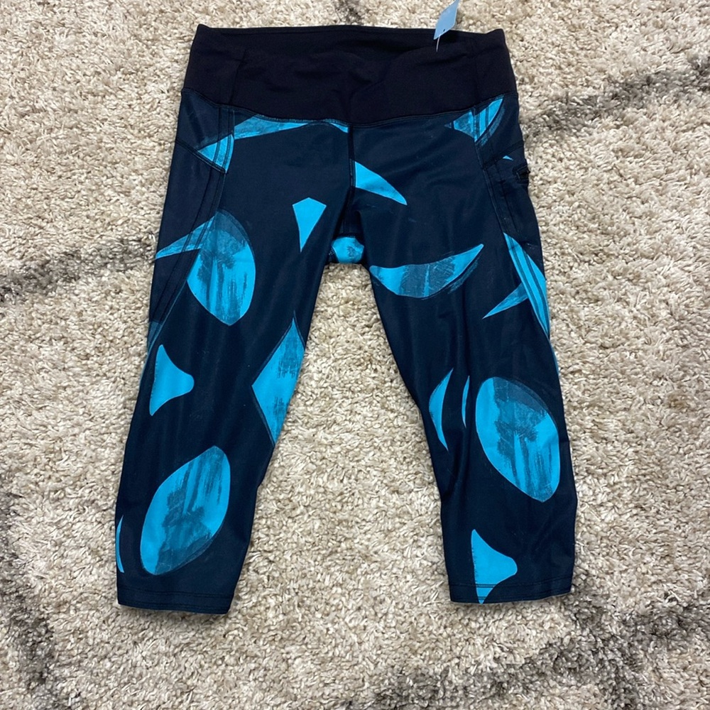 29 -Lululemon Run: Top Speed Crop
Back Spin Stroke Peacock Blue Black -17”